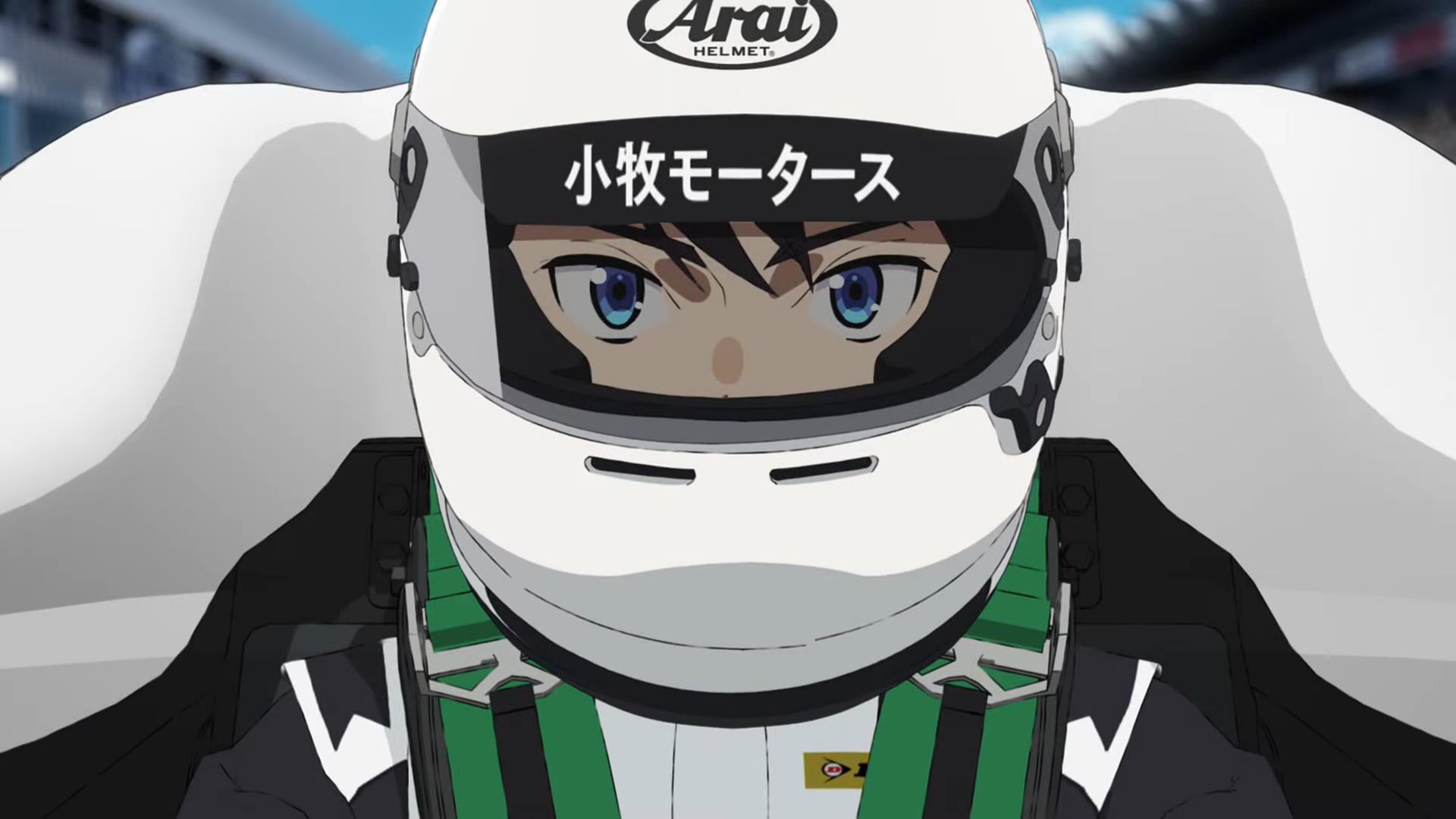 A closeup of a man in a white and black F4 racing uniform.